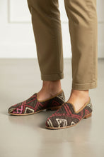 Load image into Gallery viewer, Pair of patterned shoes with 'Kilims' branding on a white background