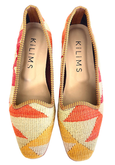 women's kilim loafers size 39 in warm orange, yellow, and eggshell colors with a slight heel