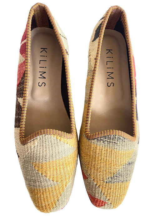 Pair of Kilims shoes with geometric pattern in soft yellow and beige