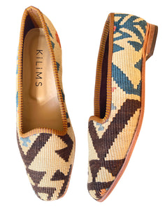 Pair of cream kilim loafers with geometric pattern